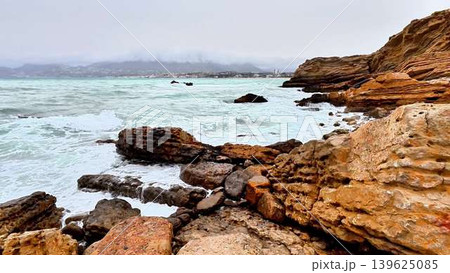 A Serene Coastal Landscape Featuring a Majestic Rocky Shoreline and Stunning Turquoise Waves A Serene Coastal Landscape Featuring a Majestic Rocky Shoreline and Stunning Turquoise Waves 139625085