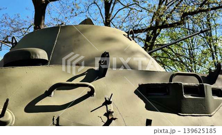 A military tank positioned in a natural setting, showcasing its robust design and functionality 139625185