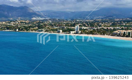 Experience the Stunning Aerial View of a Coastal Paradise with Crystal Clear Waters 139625243