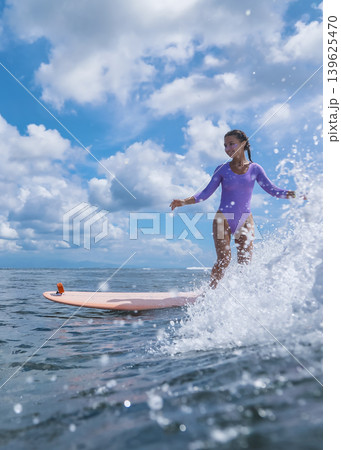 Girl Enjoys Longboard At Coast, Youthful Lady Rides Longboard Near Sunny Waves Girl Enjoys Longboard At Coast, Youthful Lady Rides Longboard Near Sunny Waves 139625470