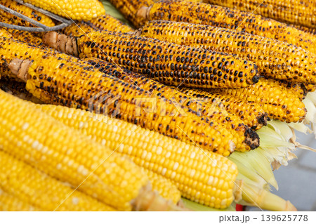 Grilled corn on cob at street food market close up Grilled corn on cob at street food market close up 139625778