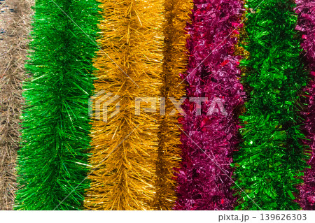 Christmas bright colored tinsel decor christmas background decorations colorful vibrant festive object Christmas bright colored tinsel decor christmas background decorations colorful vibrant festive object 139626303
