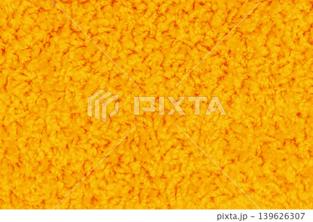 Orange-yellow bright vibrant color surface soft carpet pattern texture abstract background structure backdrop 139626307