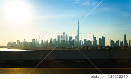 Dubai, United Arab Emirates - Jan 20 2024, panoramic view from the highway to the Dubai urban area with the Burj Khalifa Tower as the dominant, at daytime in clear weather, Dubai, UAE Dubai, United Arab Emirates - Jan 20 2024, panoramic view from the highway to the Dubai urban area with the Burj Khalifa Tower as the dominant, at daytime in clear weather, Dubai, UAE 139628259