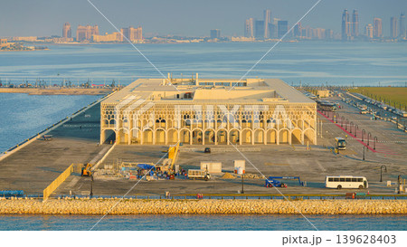 Doha, Qatar - Jan 14 2024, aerial sea view of new cruise terminal of Doha Port, with buildings and skyscrapers on background, at daytime, Doha, Qatar Doha, Qatar - Jan 14 2024, aerial sea view of new cruise terminal of Doha Port, with buildings and skyscrapers on background, at daytime, Doha, Qatar 139628403