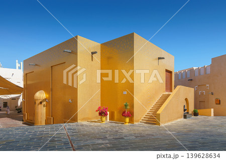 Doha, Qatar - Jan 14 2024, Panoramic view of Golden Mosque decorated with golden tiles, in Katara cultural village at daytime with blue sky, Doha, Qatar Doha, Qatar - Jan 14 2024, Panoramic view of Golden Mosque decorated with golden tiles, in Katara cultural village at daytime with blue sky, Doha, Qatar 139628634