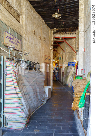 Doha, Qatar - Jan 14 2024, Panoramic view of the narrow market street with shops covered with canvas, in Souq Waqif bazaar, at daytime, Doha, Qatar 139628674