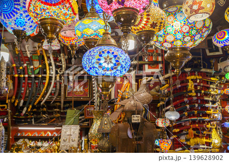 Doha, Qatar - Jan 14 2024, View of the interior of an Arab souvenir shop with lots of colorful glass lamps, lanterns and other things, at Souq Waqif Bazaar, Doha, Qatar 139628902