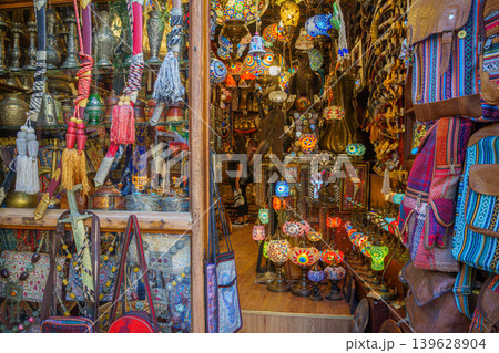 Doha, Qatar - Jan 14 2024, View of the interior of an Arab souvenir shop with lots of colorful glass lamps, lanterns and other things, at Souq Waqif Bazaar, Doha, Qatar 139628904