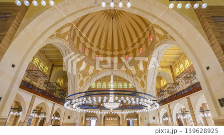 Manama, Bahrain - Jan 15 2024, Panoramic view of the interior, ceiling, dome of the Grand Mosque Al Fateh, Islamic cultural Center Al Fateh, where tourists and guides walk, Manama, Bahrain Manama, Bahrain - Jan 15 2024, Panoramic view of the interior, ceiling, dome of the Grand Mosque Al Fateh, Islamic cultural Center Al Fateh, where tourists and guides walk, Manama, Bahrain 139628925
