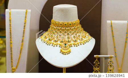 Manama, Bahrain - Jan 15 2024, a close up view of golden jewellery necklace in a showcase, in jewellery shop in Souq Bab Al Bahrain, Manama, Bahrain  139628941