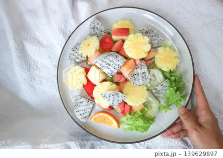 fruit salad or fruit and vegetable salad or dragon fruit , pineapple and apple salad 139629897