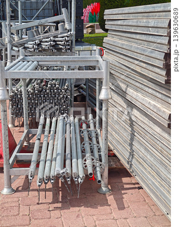 Stacked aluminum stage platforms and scaffolding poles Stacked aluminum stage platforms and scaffolding poles 139630689