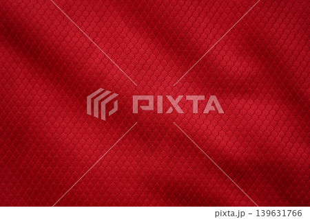 Close up of red football jersey sports clothing fabric texture. Close up of red football jersey sports clothing fabric texture. 139631766