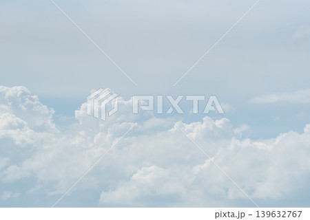 Soft white clouds floating across pale blue sky with peaceful atmosphere and airy natural background ideal for weather and nature themes Soft white clouds floating across pale blue sky with peaceful atmosphere and airy natural background ideal for weather and nature themes 139632767