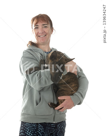 miniature bull terrier and woman in studio miniature bull terrier and woman in studio 139634247