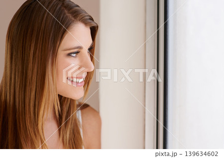 Woman, smile and thinking at window for holiday vacation or relax thoughts for peace, weekend or calm. Female person, happy and contemplating in home apartment for positive ideas, morning or rest Woman, smile and thinking at window for holiday vacation or relax thoughts for peace, weekend or calm. Female person, happy and contemplating in home apartment for positive ideas, morning or rest 139634602