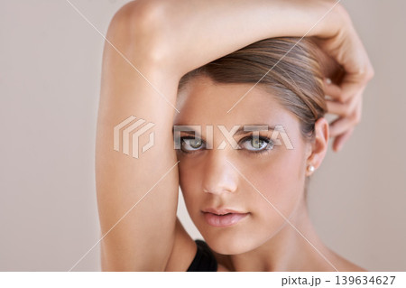Portrait, beauty and skincare of woman in makeup at spa facial treatment for aesthetic. Face, confident model in cosmetics and glow for wellness, serious and isolated on a brown studio background Portrait, beauty and skincare of woman in makeup at spa facial treatment for aesthetic. Face, confident model in cosmetics and glow for wellness, serious and isolated on a brown studio background 139634627