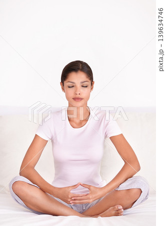 Relax, calm and young woman with meditation for peace, zen and mindful wellness on bed. Serenity, health and female person in position for spiritual chakra balance in bedroom at apartment. Relax, calm and young woman with meditation for peace, zen and mindful wellness on bed. Serenity, health and female person in position for spiritual chakra balance in bedroom at apartment. 139634746
