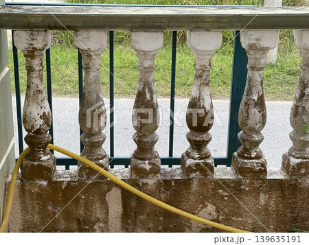 Severely Weathered White Balusters With Mold And Peeling Paint 139635191