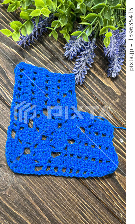 Knitting patterns with a raised pattern and yarn in different colors. Copy space 139635415