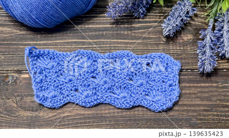 Knitting patterns with a raised pattern and yarn in different colors. Copy space 139635423