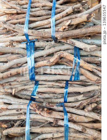 Firewood Bundle Background with Natural Wood Texture Firewood Bundle Background with Natural Wood Texture 139635547