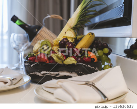 tropical fruits and wine in hotel room tropical fruits and wine in hotel room 139636635