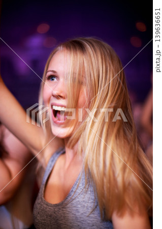 Woman, dancing and music festival, happy and party in nightclub, celebrating and dj event. Disco, rock and freedom with girl dancer in crowd of fans for celebration, energy and techno performance Woman, dancing and music festival, happy and party in nightclub, celebrating and dj event. Disco, rock and freedom with girl dancer in crowd of fans for celebration, energy and techno performance 139636651