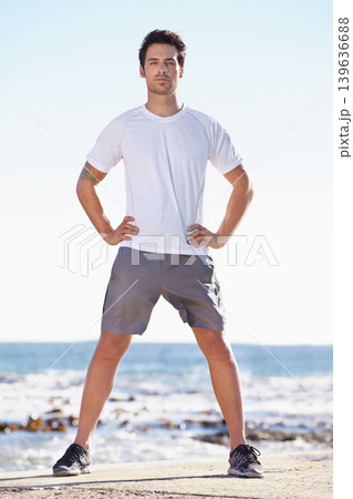 Man, fitness and portrait on beach, runner outdoor for cardio and exercise, ocean and nature with athlete. Sports, running and endurance with training or workout for health and wellness with travel 139636688