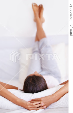 Sleeping, pillow and person relax in bedroom for comfort, cozy nap and rest on home mattress for recovery. Cushion, fatigue and sleep on cotton bedsheets with calm, peace and morning wellness Sleeping, pillow and person relax in bedroom for comfort, cozy nap and rest on home mattress for recovery. Cushion, fatigue and sleep on cotton bedsheets with calm, peace and morning wellness 139636812