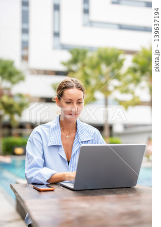 Lifestyle working woman using laptop and smartphone to search information online. technology and everyday life. Lifestyle working woman using laptop and smartphone to search information online. technology and everyday life. 139637194