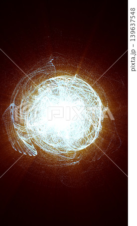 Intense white particle energy sphere with glowing orange aura, chaotic light trails, and abstract plasma motion. 139637548