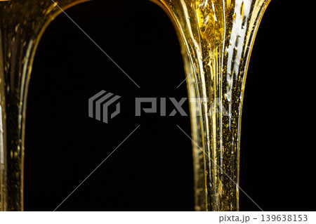 Flowing golden honey with air bubbles texture. Flowing golden honey with air bubbles texture. 139638153
