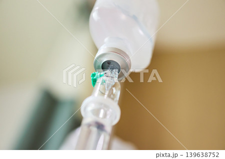 Close up medical intravenous IV drip in hospital background 139638752