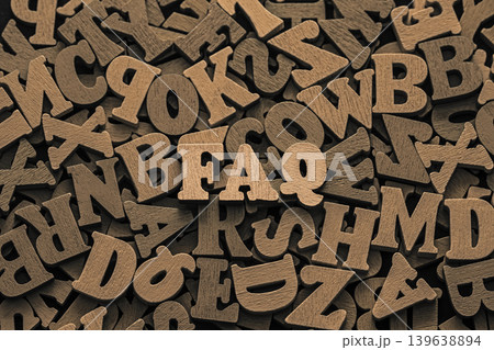 Inscription faq on pile of old vintage wooden letters. 139638894