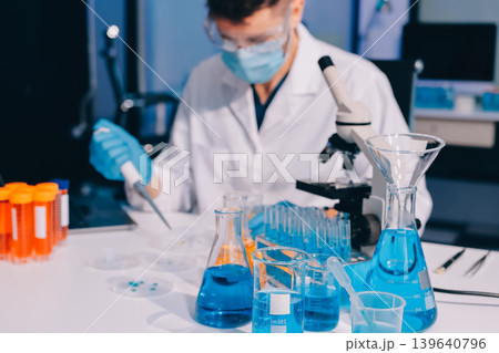 Lab technician experimenting in lab Lab technician experimenting in lab 139640796