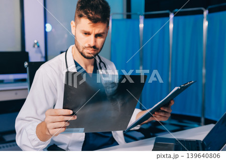 Man, doctor and laptop typing in healthcare research, communication or social media at office desk. Male medical expert working on computer in online search, browsing or chatting on tablet at clinic Man, doctor and laptop typing in healthcare research, communication or social media at office desk. Male medical expert working on computer in online search, browsing or chatting on tablet at clinic 139640806