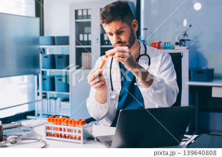 Attractive student of chemistry working in laboratory Attractive student of chemistry working in laboratory 139640808