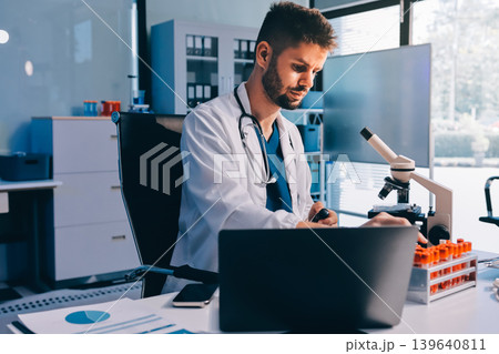 Attractive student of chemistry working in laboratory Attractive student of chemistry working in laboratory 139640811