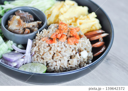 shrimp paste rice, fried rice or stir fried rice with egg and vegetable or Thai shrimp paste fried rice or rice mixed with shrimp paste or Thai fried rice 139642372