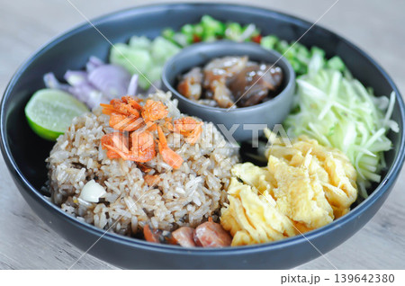 shrimp paste rice, fried rice or stir fried rice with egg and vegetable or Thai shrimp paste fried rice or rice mixed with shrimp paste or Thai fried rice 139642380