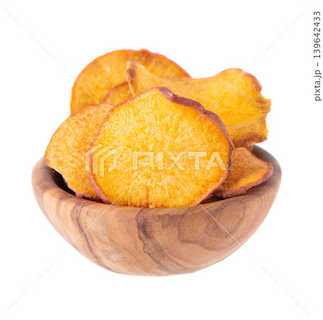 Crispy roasted sweet potato chips with sea salt, isolated on white background. Healthy and crunchy natural vegetable snack. Clipping path. 139642433