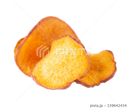 Crispy roasted sweet potato chips with sea salt, isolated on white background. Healthy and crunchy natural vegetable snack. Clipping path. Crispy roasted sweet potato chips with sea salt, isolated on white background. Healthy and crunchy natural vegetable snack. Clipping path. 139642434