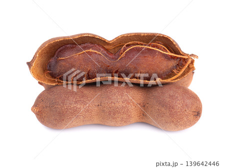 Fresh tamarind pods and open shell with pulp isolated on white background. 139642446