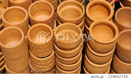 Stacks of new unglazed terracotta clay pots Stacks of new unglazed terracotta clay pots 139642730