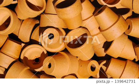 Top view of many small unglazed terracotta clay pots arranged in pile Top view of many small unglazed terracotta clay pots arranged in pile 139642731
