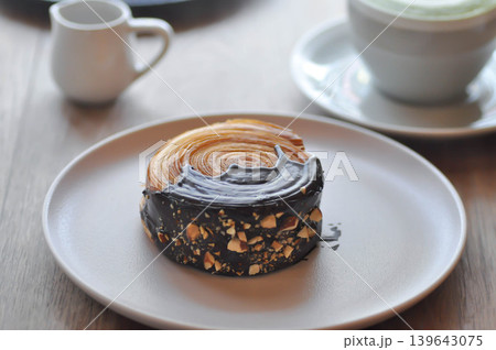 timber ring or chocolate timber ring or bread or round croissant and matcha latte 139643075
