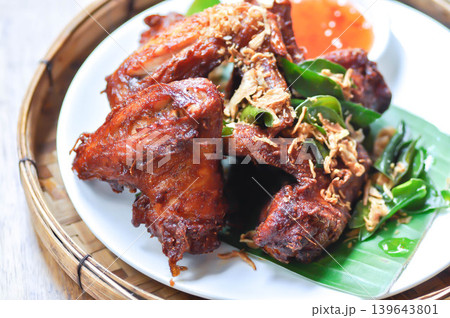 fried chick with fried garlic or chicken wings or deep fried chicken , fried chicken and sauce fried chick with fried garlic or chicken wings or deep fried chicken , fried chicken and sauce 139643801