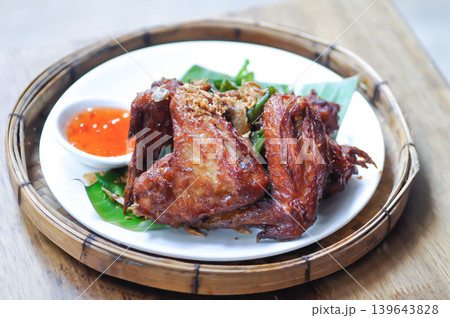 fried chick with fried garlic or chicken wings or deep fried chicken , fried chicken and sauce fried chick with fried garlic or chicken wings or deep fried chicken , fried chicken and sauce 139643828